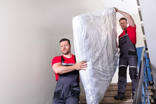 maneuvering a box spring through a doorway during removal in Coventry